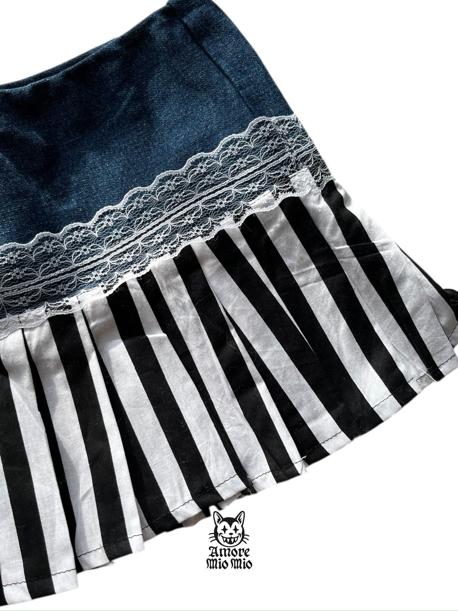 Mini falda de tiro bajo con pliegues