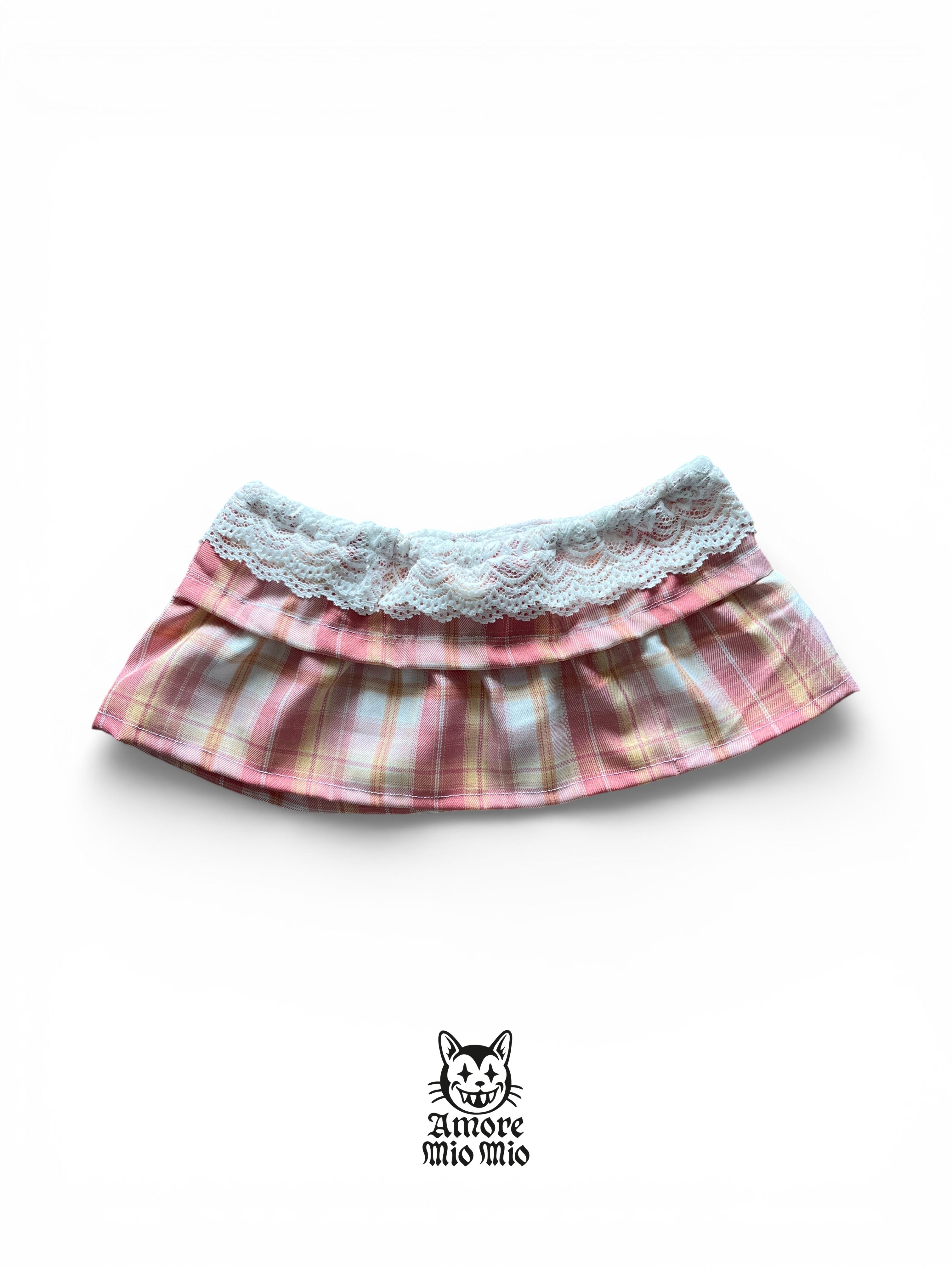 Mini falda Y2K de cuadros rosa con encaje blanco